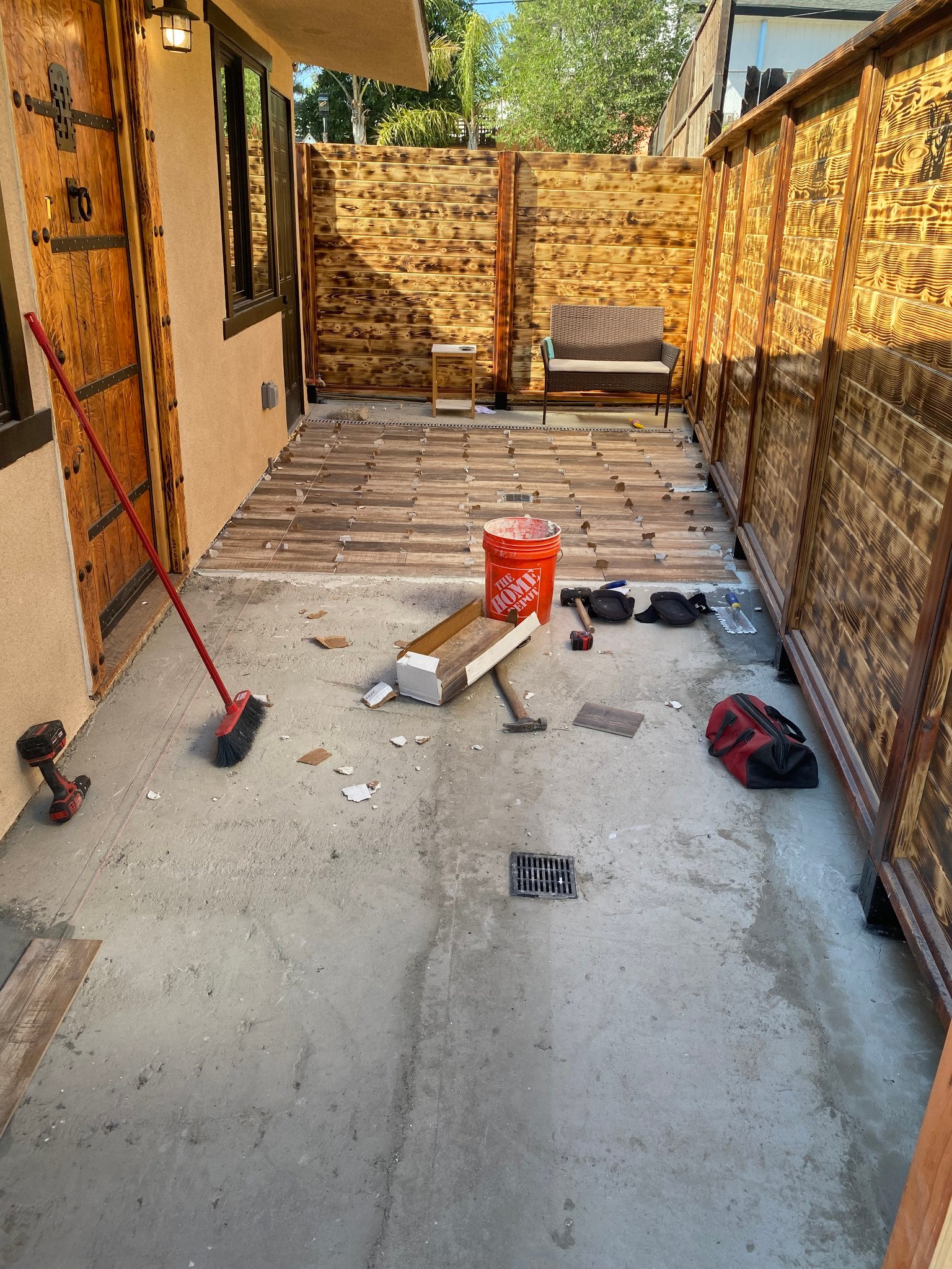 Wood-look outdoor tile being installed